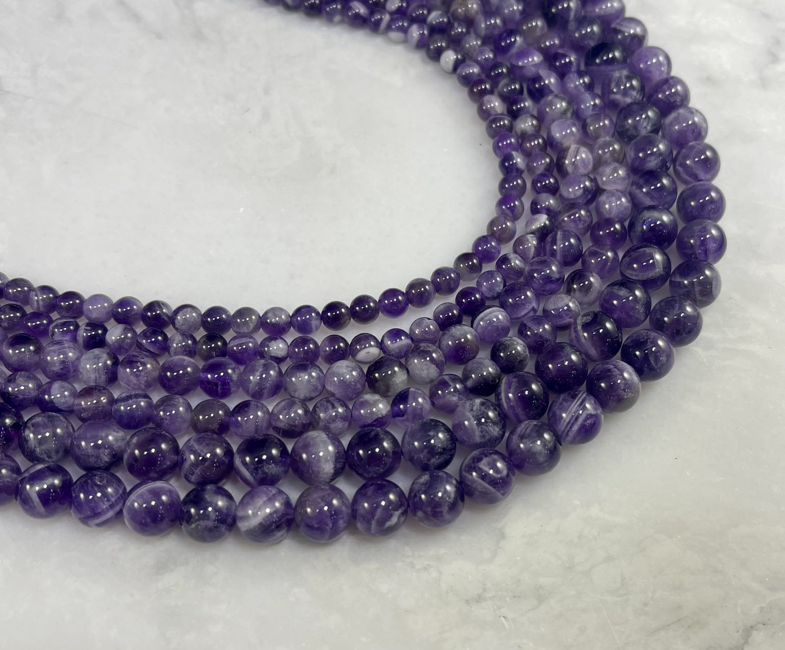 Dog Tooth Amethyst Round - Rubber City Bargains